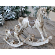 Krémszínű karácsonyi dekorációs hintaló.