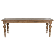 Natúr színű, díszes lábú teakfa étkezőasztal.