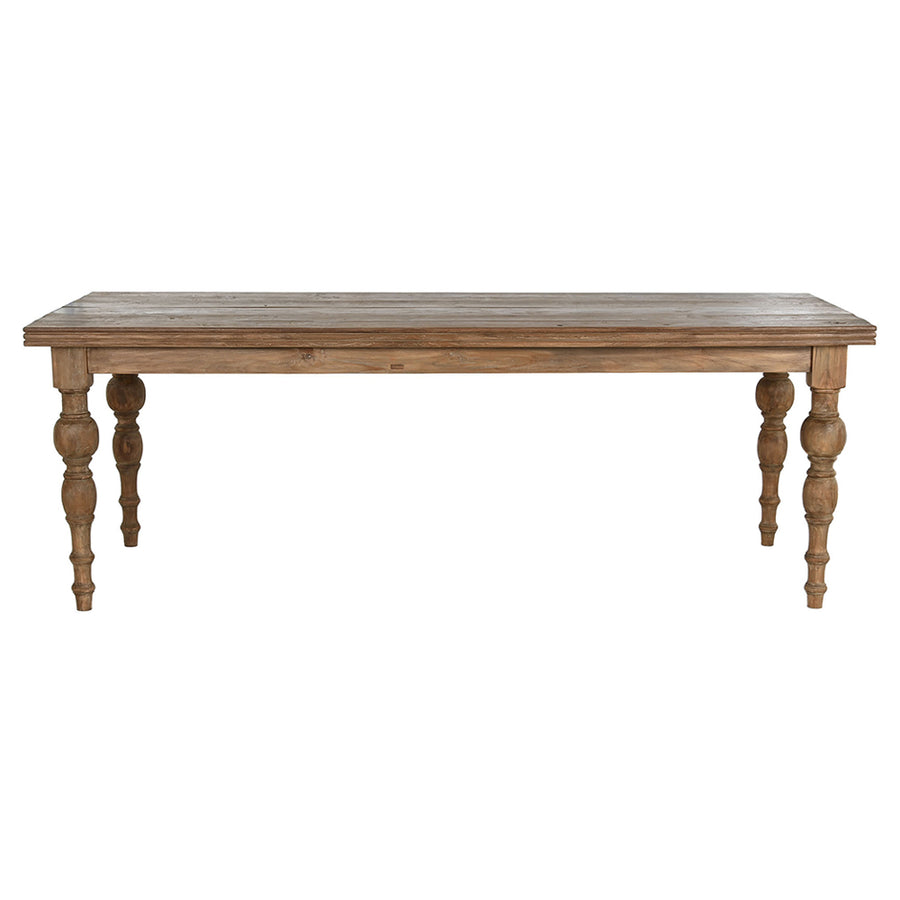 Natúr színű, díszes lábú teakfa étkezőasztal.