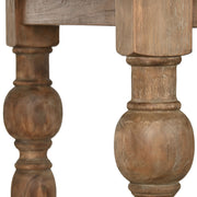 Natúr színű, díszes lábú teakfa étkezőasztal.