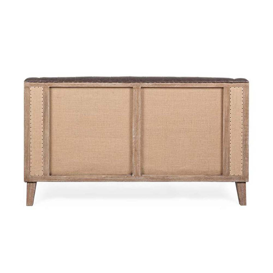 Loft stílusú, sötétbarna bőrrel kárpitozott kőrisfa kanapé nyitott hátoldala.