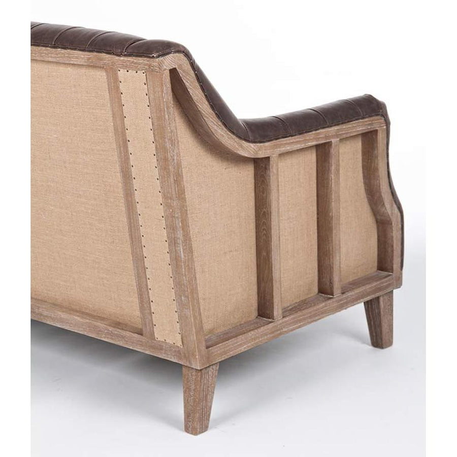 Loft stílusú, sötétbarna bőrrel kárpitozott kőrisfa kanapé nyitott oldala.