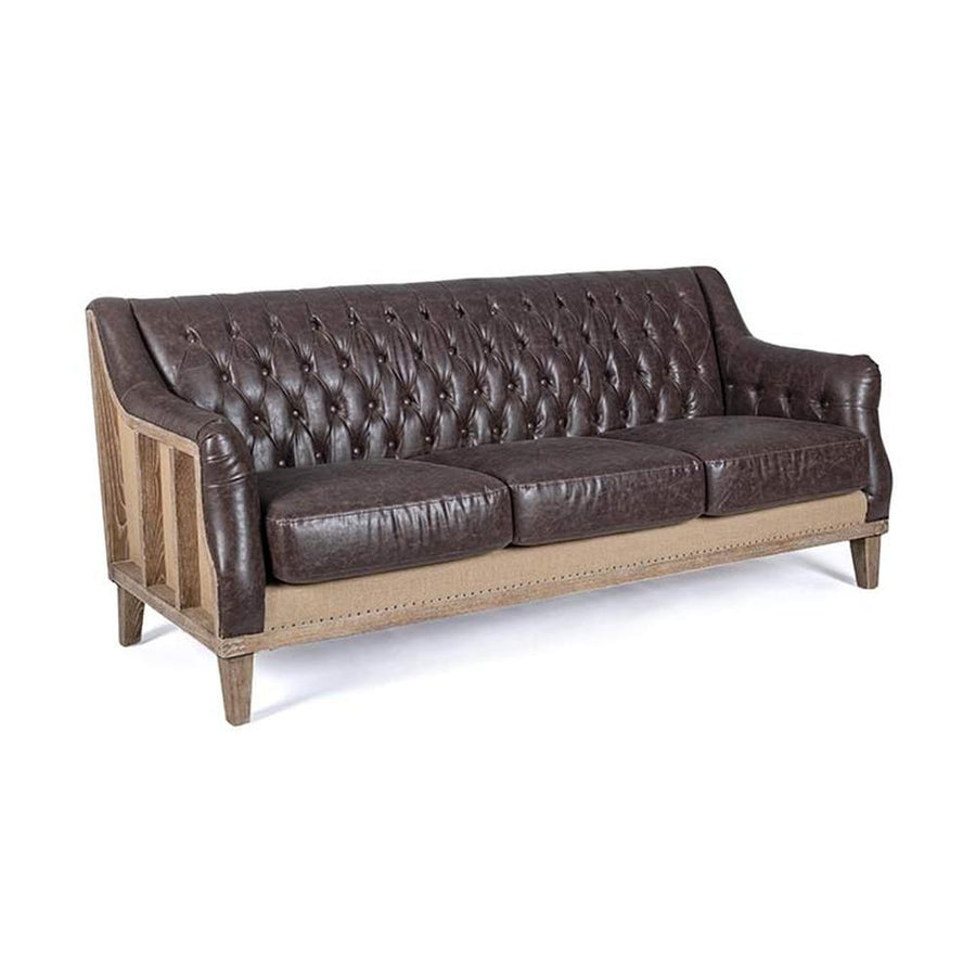 Loft stílusú, sötétbarna bőrrel kárpitozott kőrisfa kanapé.