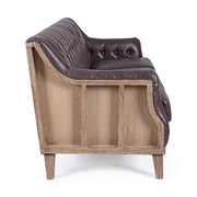 Loft stílusú, sötétbarna bőrrel kárpitozott kőrisfa kanapé.