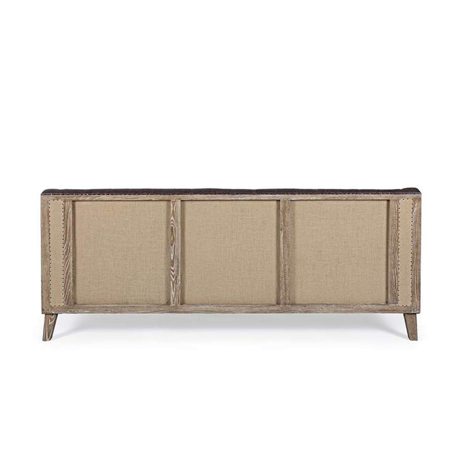 Loft stílusú, sötétbarna bőrrel kárpitozott kőrisfa kanapé.