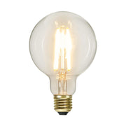 Clear Filament dekorációs izzó. Meleg fehér fényű LED dekorációs izzó áttetsző üveggel.