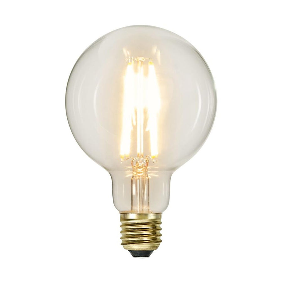 Clear Filament dekorációs izzó. Meleg fehér fényű LED dekorációs izzó áttetsző üveggel.