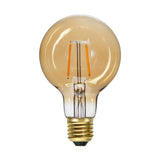 Amber Soft Glow vintage LED dekorációs izzó. Meleg fehér fényű, borostyánszín üveggel.