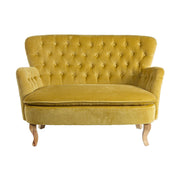 Vintage stílusú, fenyőfából készült, mustársárga színű, bársonyhatású kanapé.