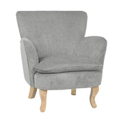 Retró stílusú, világosszürke színű, kordbársony-hatású szövettel kárpitozott kaucsukfa fotel.