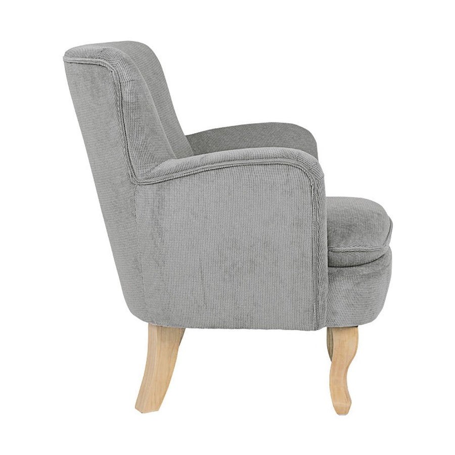 Retró stílusú, világosszürke színű, kordbársony-hatású szövettel kárpitozott kaucsukfa fotel.