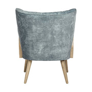 Retró stílusú, világoskék bársonyhatású szövettel kárpitozott kaucsukfa klubfotel.