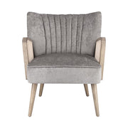 Retró stílusú, világosszürke bársonyhatású szövettel kárpitozott kaucsukfa klubfotel.