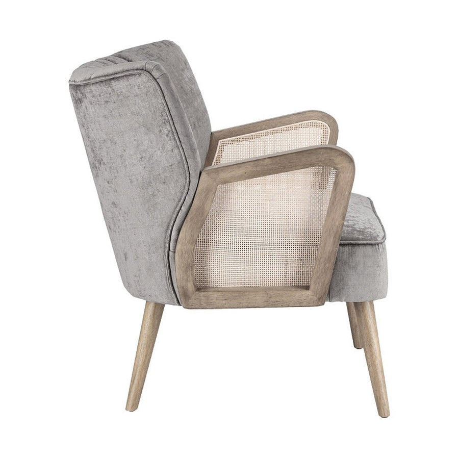 Retró stílusú, világosszürke bársonyhatású szövettel kárpitozott kaucsukfa klubfotel.