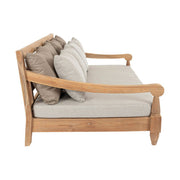 Keleti stílusú teakfa kanapé bézs színű ülő- és hátpárnákkal.