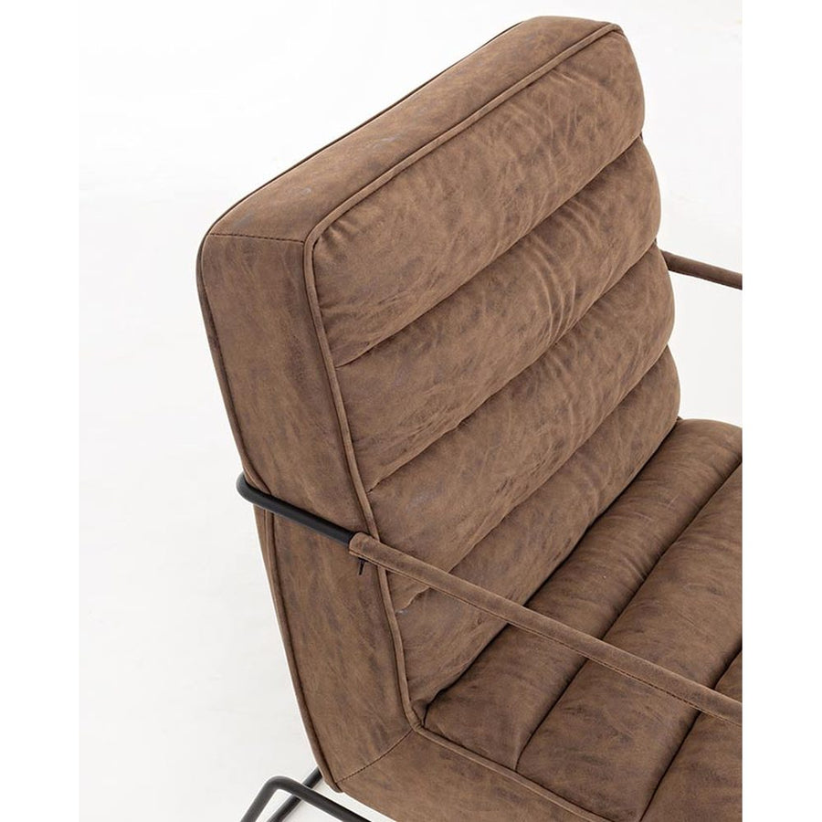 Barna színű velúr műbőrrel kárpitozott kortárs stílusú fotel.