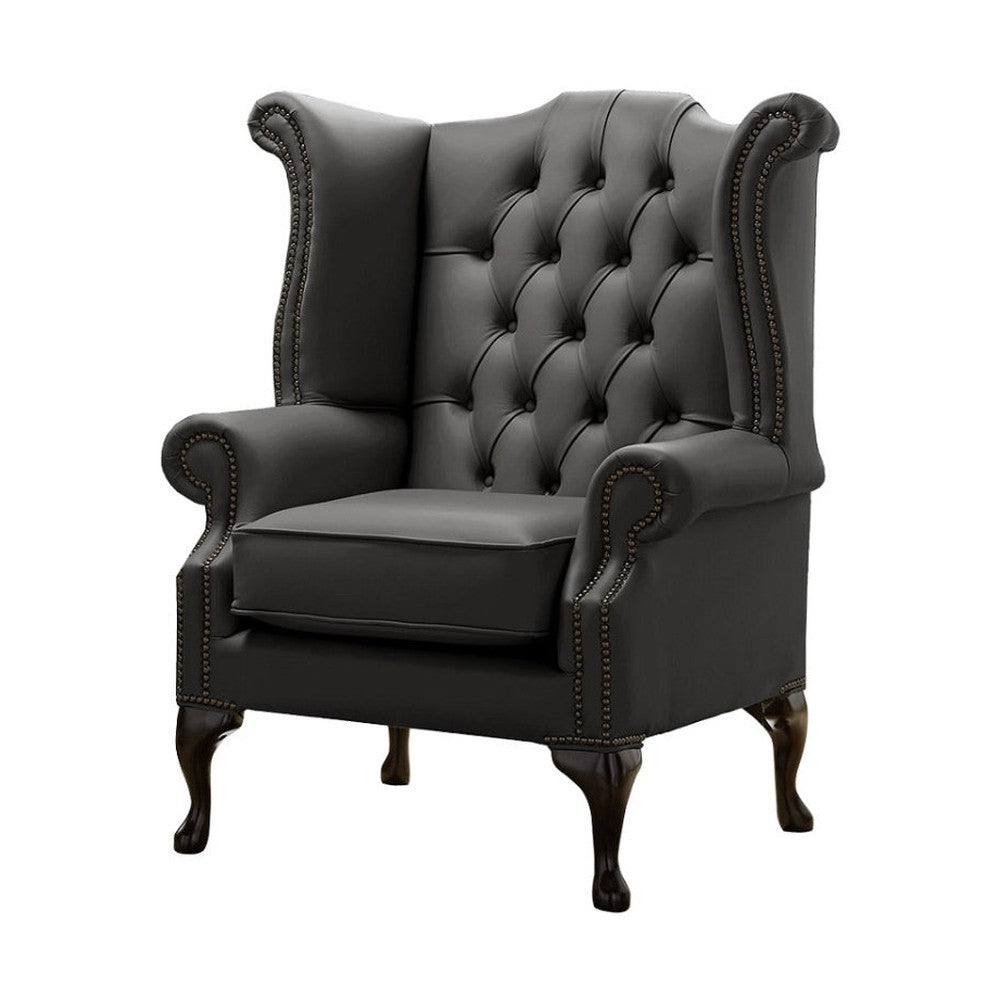 Antracitszürke színű bőrrel kárpitozott Chesterfield szárnyas fotel.