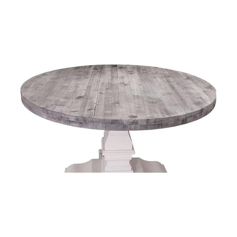 Kerek, fenyőfa étkezőasztal tölgyfa asztallappal. Az asztal lába fehér színű, az asztallap pácolt szürke.