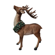 LED-es koszorúval díszített karácsonyi szarvas figura