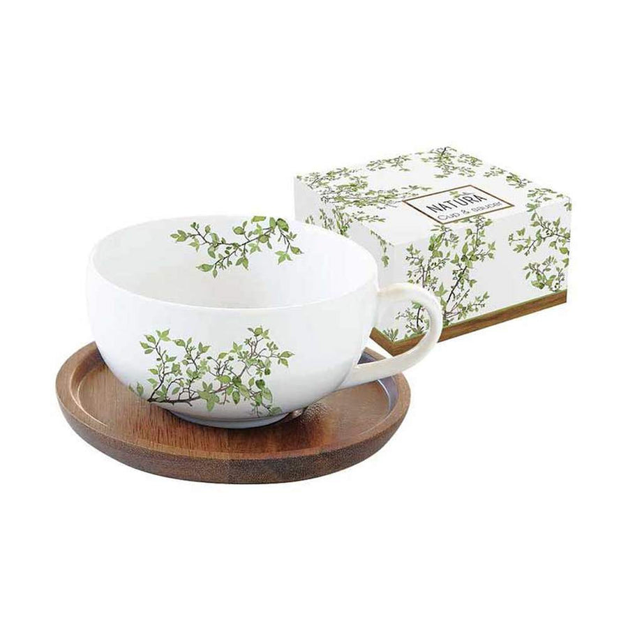 Zöldellő tavaszi faággal díszített, minőségi porcelánból készült teáscsésze akácfa alátéttel díszdobozba csomagolva a "Natura" kollekcióból