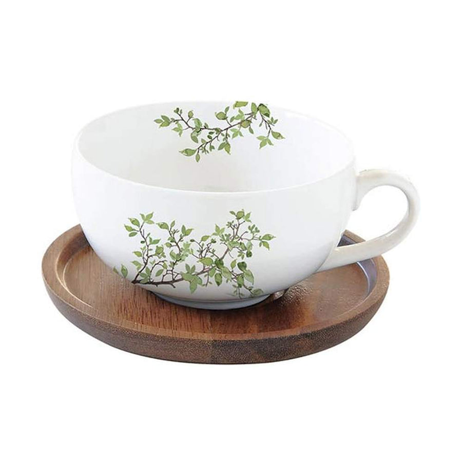 Zöldellő tavaszi faággal díszített, minőségi porcelánból készült teáscsésze akácfa alátéttel díszdobozba csomagolva a "Natura" kollekcióból