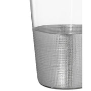 Modern, ezüstszínű fémmel díszített, üveg vizespohár.