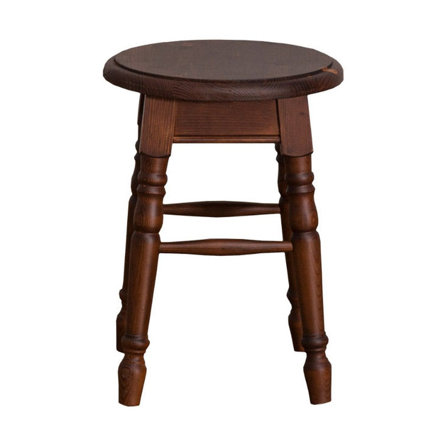 Klasszikus, kerek ülőfelülettel rendelkező hokedli, dekoratív, faragott lábakkal.