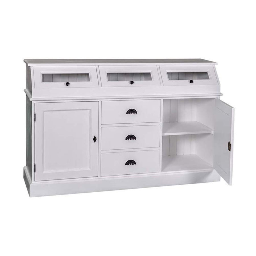 Fehér színű tálalókomód, melynek közepén három fiók került kialakításra, melyeket kétoldalról ajtó tároló zár közre. A komód felső részén három vitrines tároló került kialakításra.