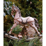 Antikolt felületű, krémszínű karácsonyi dekor hintaló..