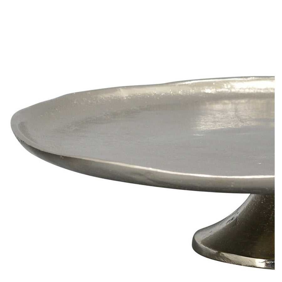 Amorf szélű, kör formájú ezüst színű fém peremestálca