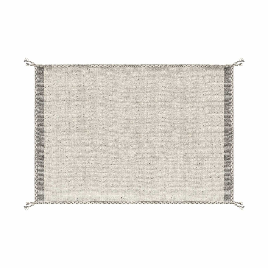 Bézs színű gyapjú szőnyeg.