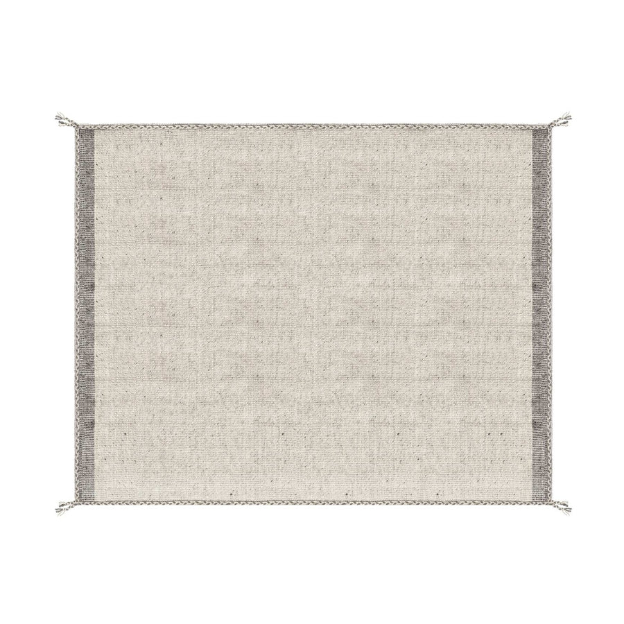 Bézs színű gyapjú szőnyeg.