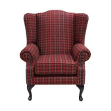 Chesterfield stílusú, magas háttámlájú, szárnyas fotel keményfa lábbakkal, balmoral kockás mintájú exkluzív minőségű gyapjúszövettel kárpitozva.