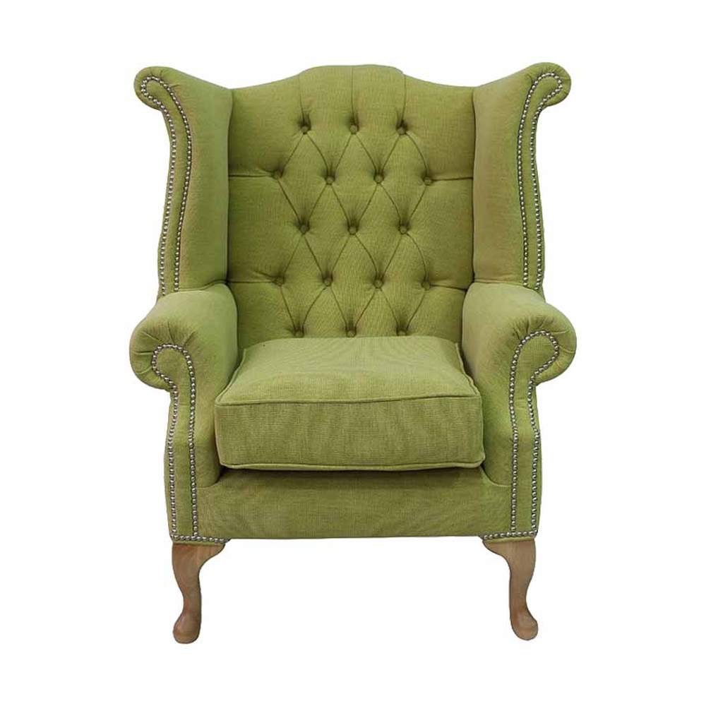 Lime zöld színű szövettel kárpitozott szárnyas Chesterfield fotel.