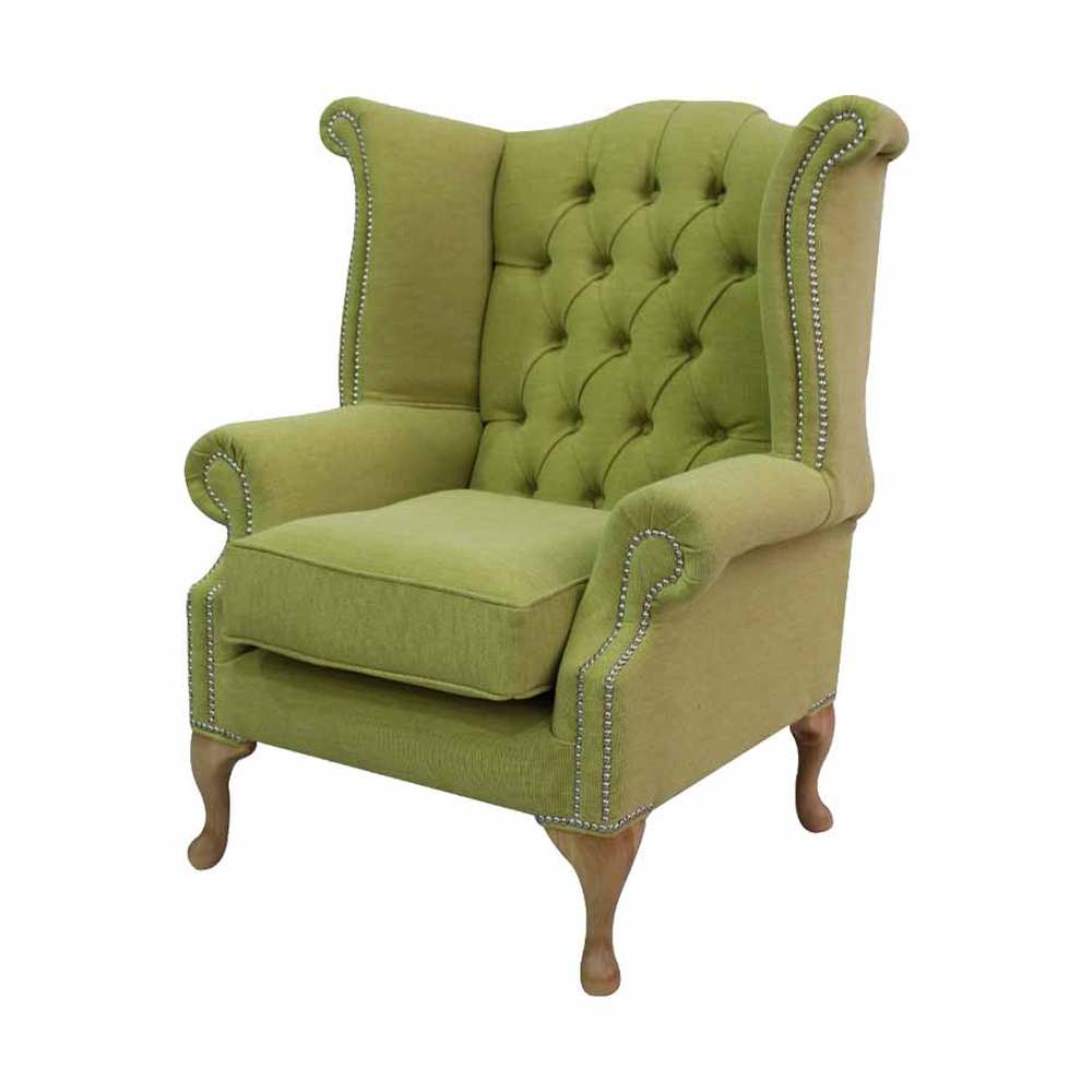 Lime zöld színű szövettel kárpitozott szárnyas Chesterfield fotel.