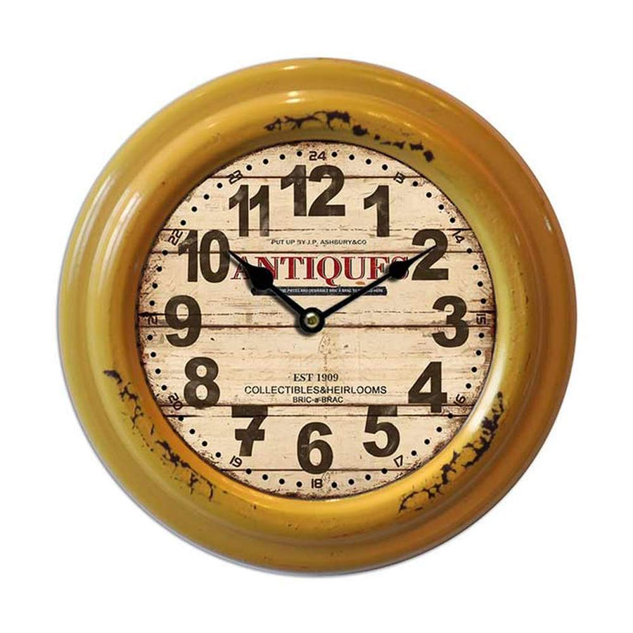 Vintage illetve loft stílusú, antikolt fém felületű falióra "Antiques" felirattal