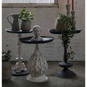 Antikolt felületű, fémből készült, fekete színű lerakó kisasztal.