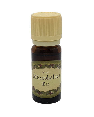 Mézeskalács illatú illóolaj 10 ml-es barna üvegben, krémszínű kupakkal, ünnepi hangulatot idéző édes-fűszeres aromával, párologtatóhoz.