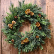 Sötétzöld színű, mű lucfenyő koszorú.