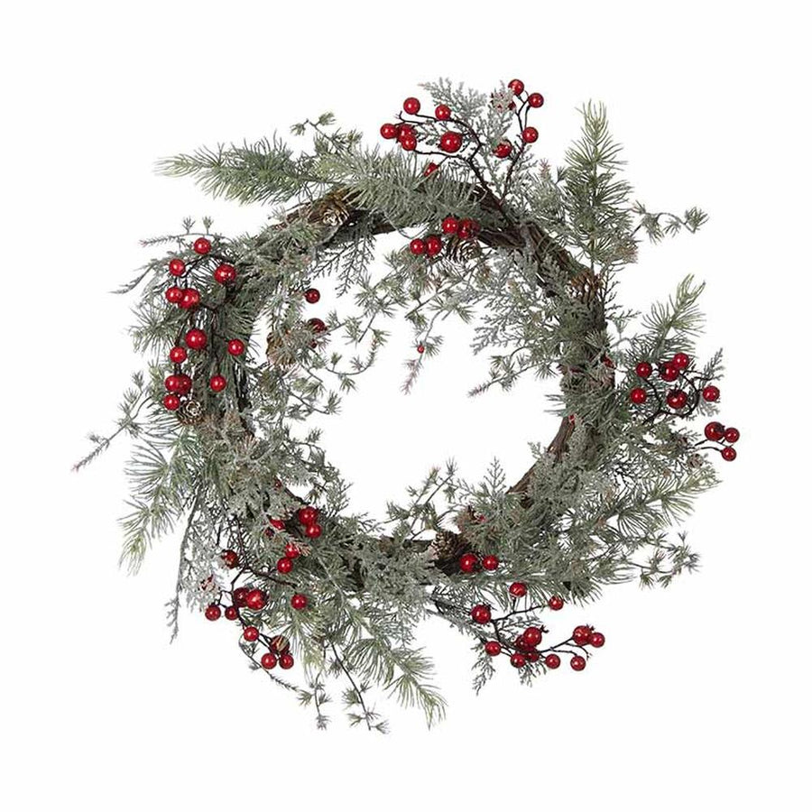 Piros bogyókkal díszített, ezüstös zöld színű mesterséges fenyőágakból készült karácsonyi koszorú, ajtódísz.