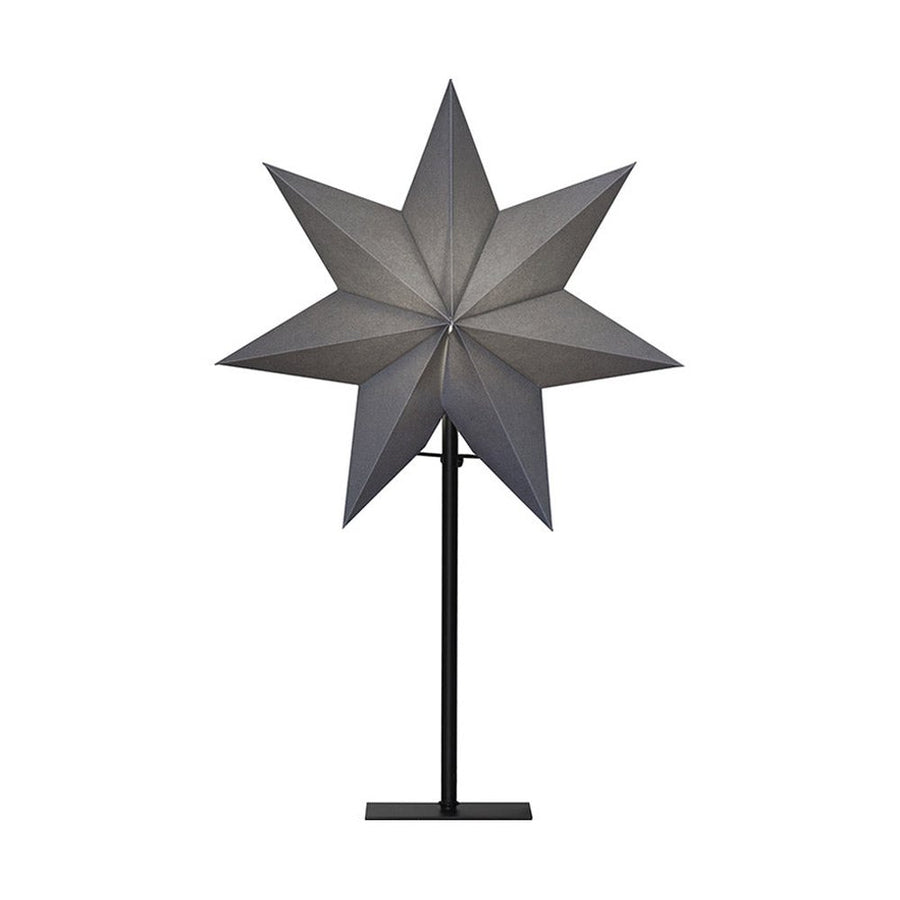 Modern, skandináv stílusú, 55 cm magas, szürkeszínű papírból készült, csillag formájú karácsonyi dekorációs lámpa fém talapzaton.