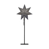 Modern, skandináv stílusú, 85 cm magas, szürkeszínű papírból készült, csillag formájú karácsonyi dekorációs lámpa fém talapzaton.