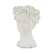 Antikolt felületű, krém színű kaspó büszt.