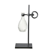 Loft stílusú,, fém lombikállványba helyezett üveg váza.