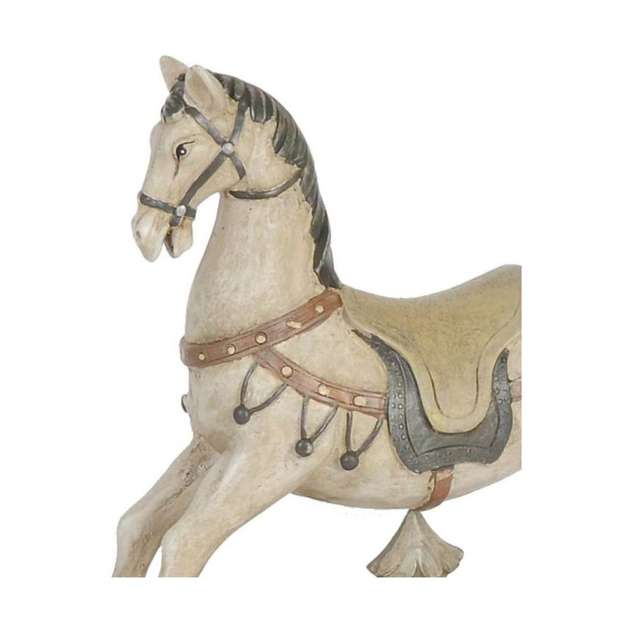 Antikolt felületű, krémszínű karácsonyi hintaló.