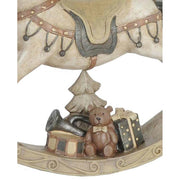 Antikolt felületű, krémszínű karácsonyi hintaló.