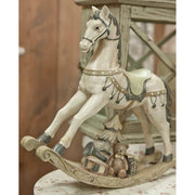 Antikolt felületű, krémszínű karácsonyi dekor hintaló..