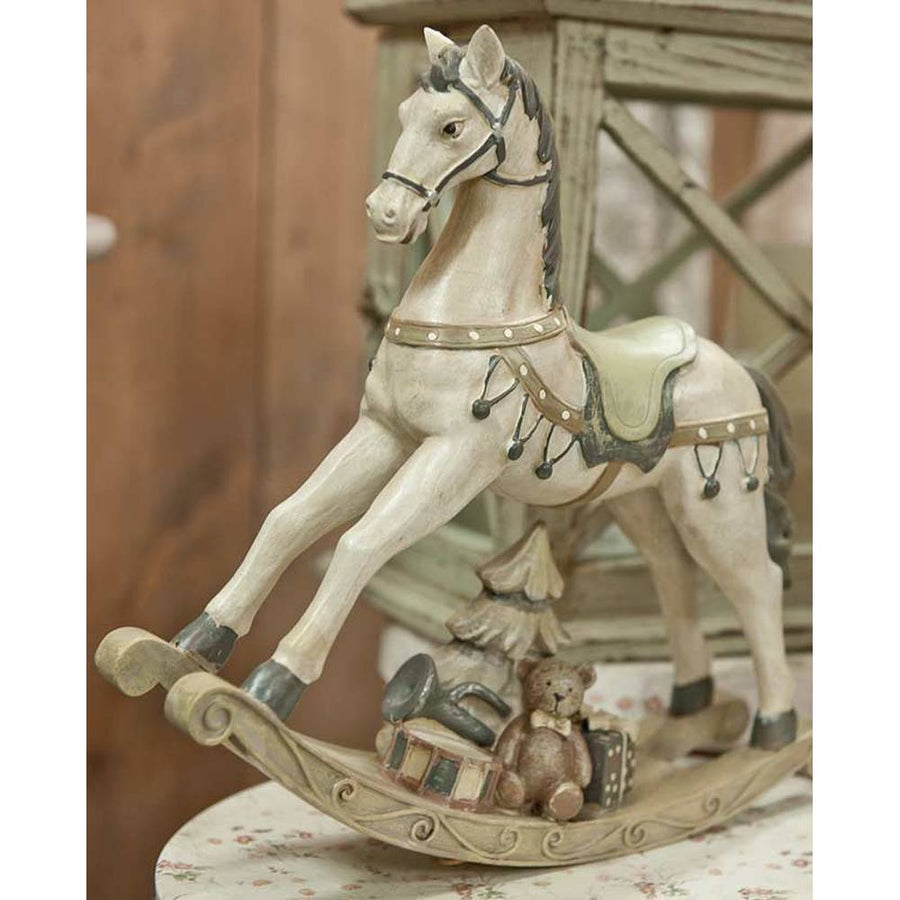 Antikolt felületű, krémszínű karácsonyi dekor hintaló..