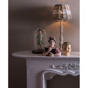 Vintage stílusú, antikolt felületű kislányfigura babával.